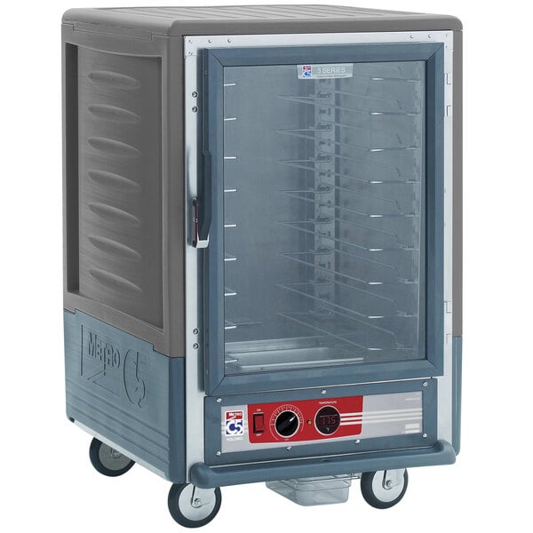 A large grey Metro C5 heated holding cabinet with a glass door.
