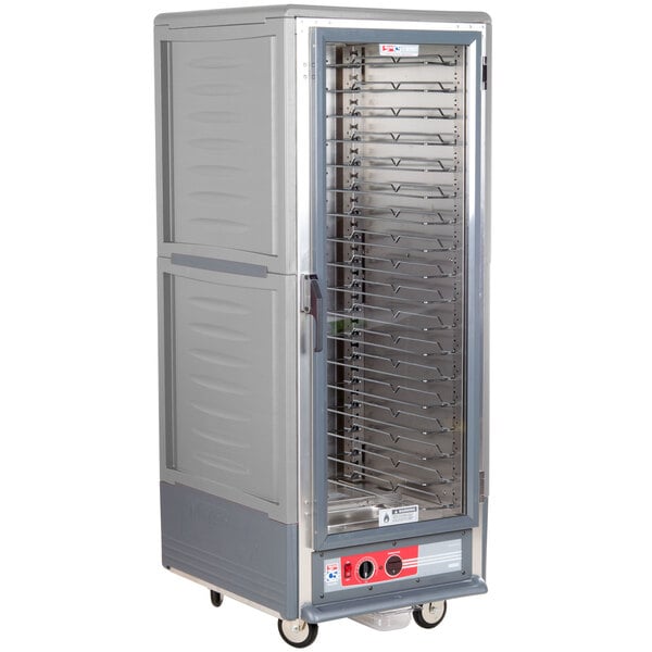 A gray Metro C5 heated holding cabinet with clear door and shelves.