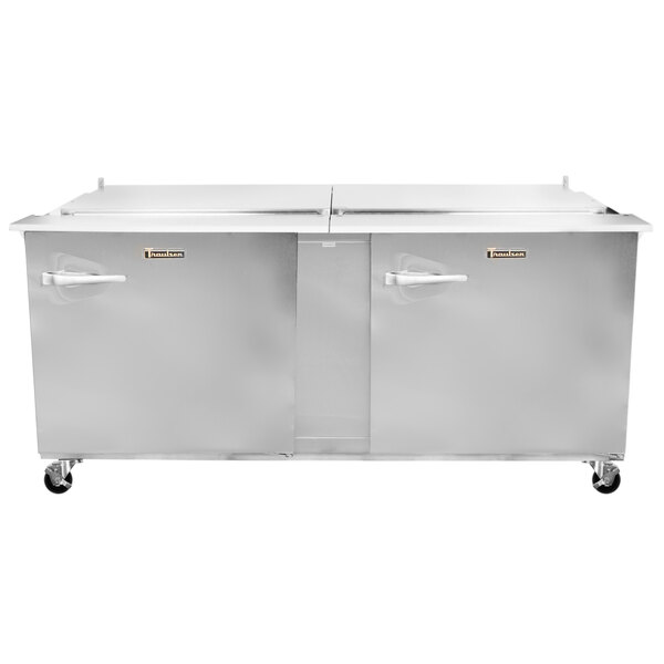 A Traulsen stainless steel refrigerated sandwich prep table with two right hinged doors.
