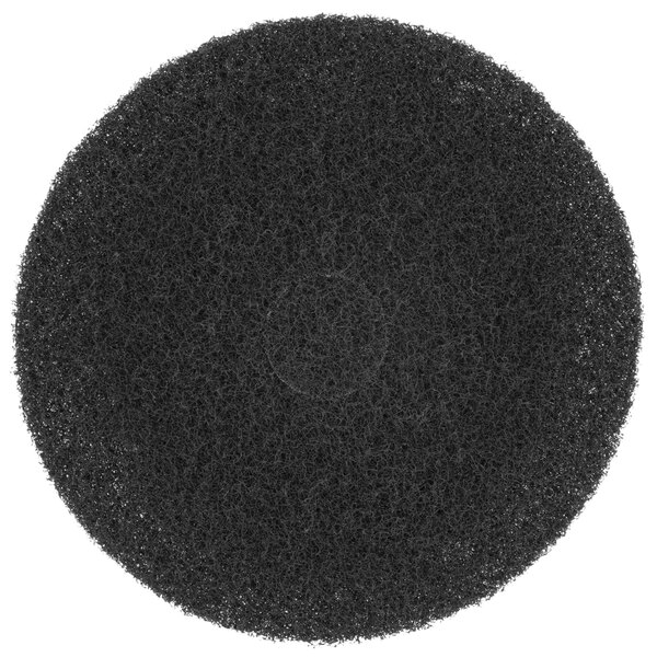 A black Scrubble super stripping floor pad with a hole in the center.