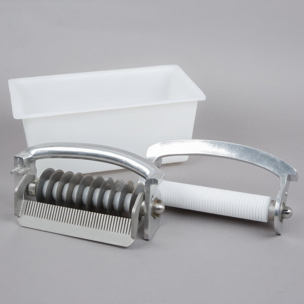 A white plastic container with a metal handle and metal comb inside.