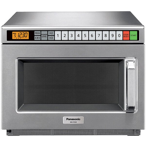 A silver Panasonic commercial microwave oven with a digital display.