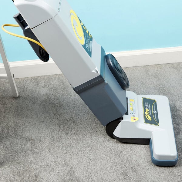 A ProTeam ProForce 1500XP vacuum cleaner on carpet.