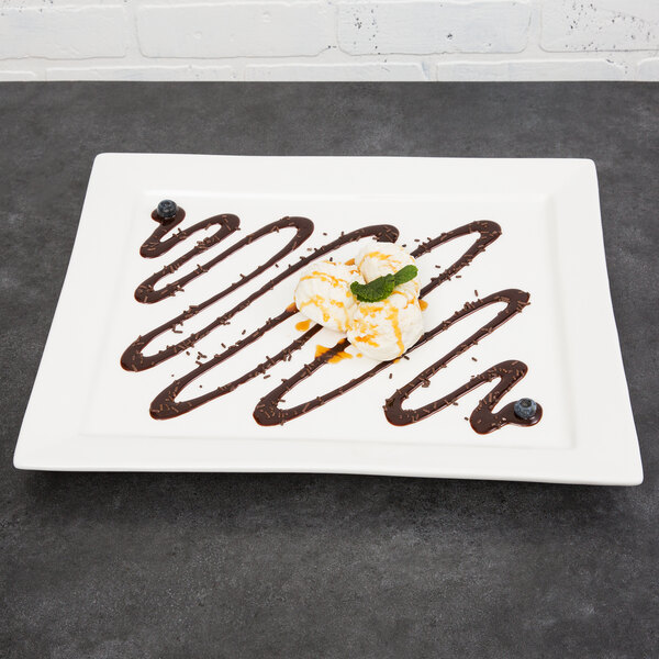 A white rectangular porcelain platter with a chocolate swirl.