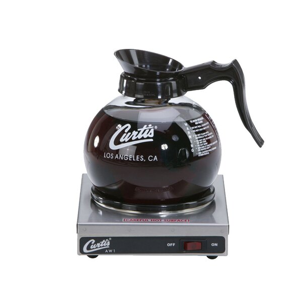A Curtis single burner decanter warmer with a glass coffee pot on a hot plate.