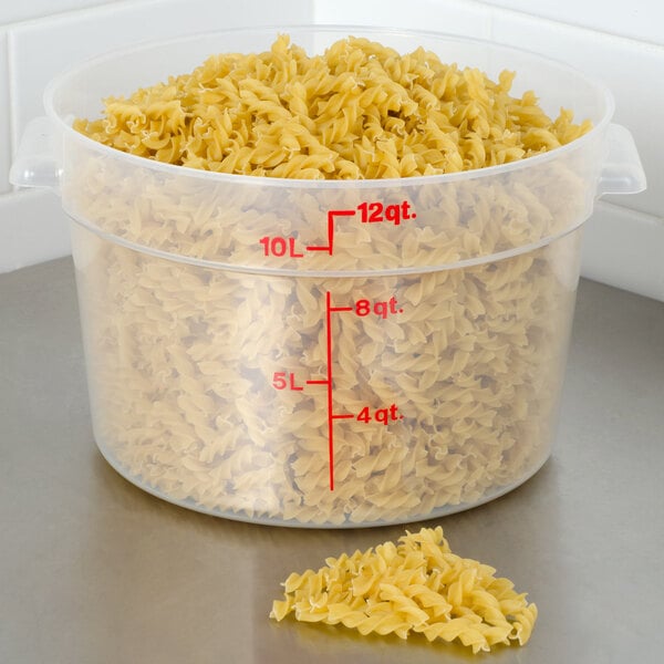 A Cambro translucent plastic food storage container with pasta inside.