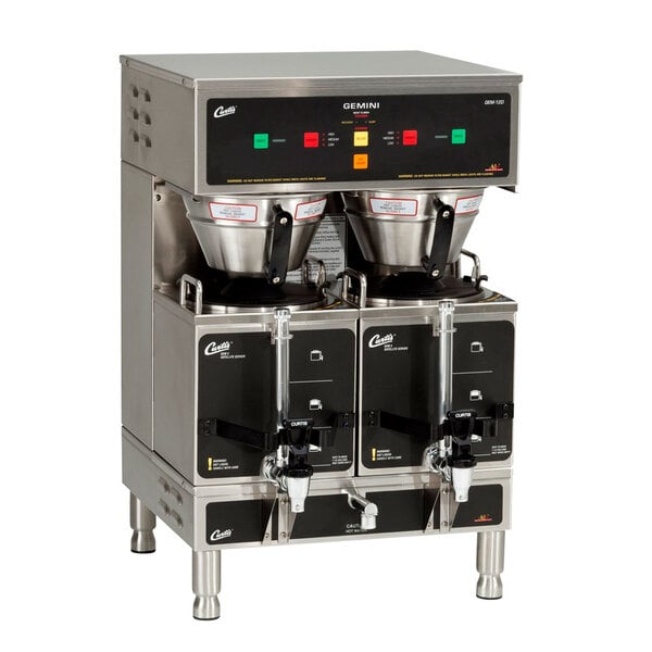 A Curtis Gemini stainless steel digital satellite coffee brewer with two coffee servers on top.