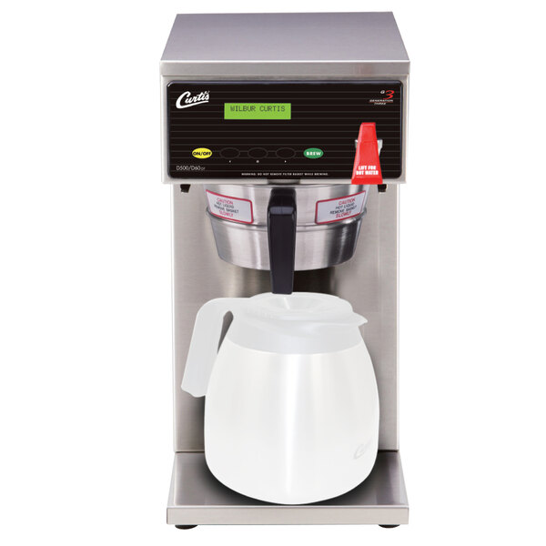 A Curtis D60GT63A000 coffee brewer with a white plastic pitcher on top.
