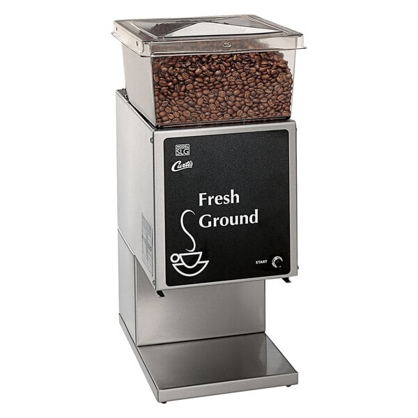 A Curtis SLG-10 automatic coffee grinder with coffee beans on top.