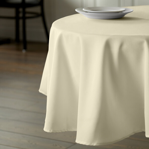 Intedge 90" Round Ivory 100% Polyester Hemmed Cloth Table Cover