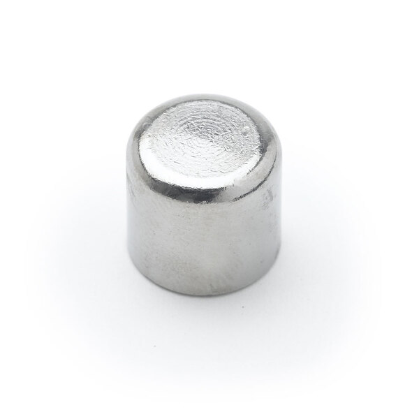 A close-up of a silver cap with a silver cylinder inside.