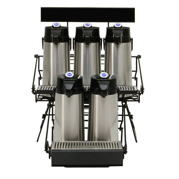 A black Curtis wire rack holding five stainless steel coffee airpots.