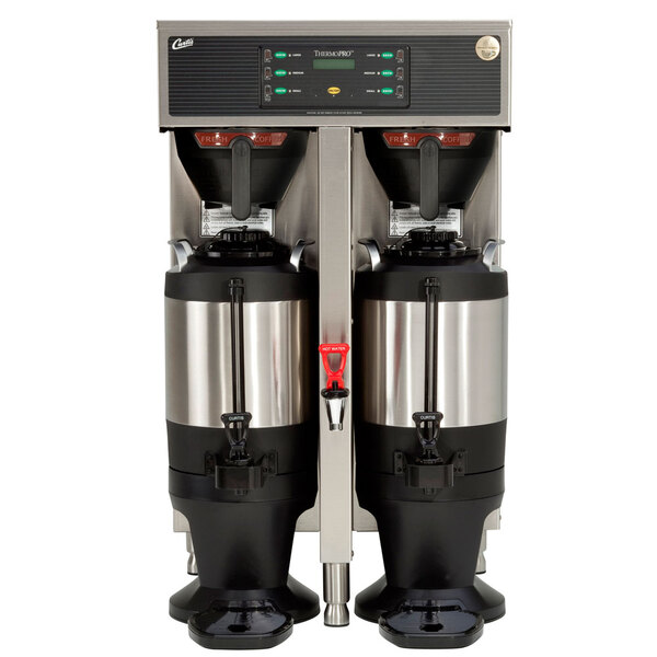 A white Curtis ThermoPro Twin commercial coffee brewer with two coffee containers on top.