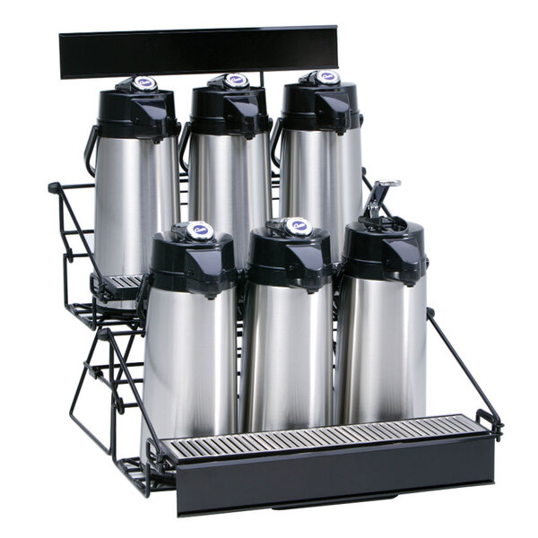 A black metal Curtis wire rack holding six silver and black coffee airpots.