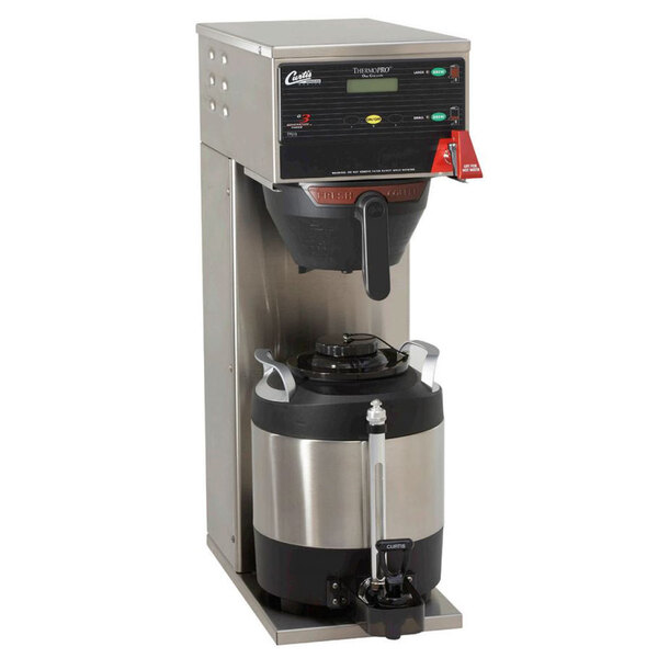 A silver and black Curtis ThermoPro coffee maker with a container.
