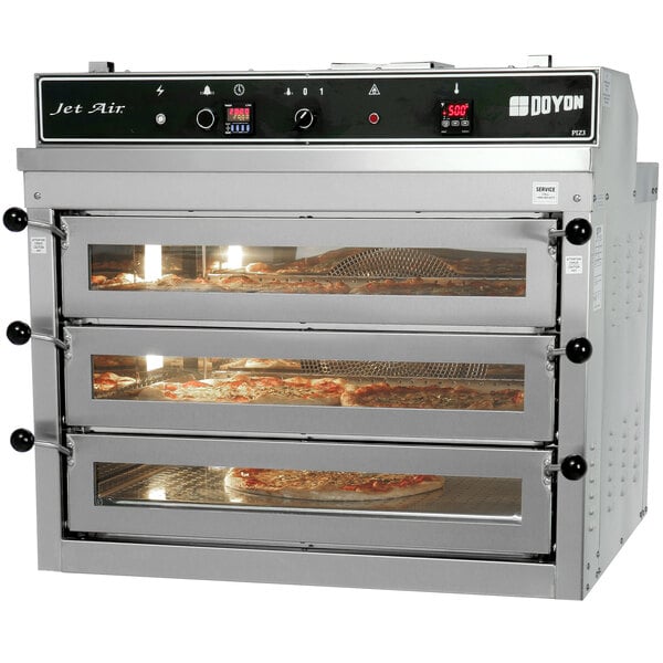 A Doyon triple deck pizza oven with pizzas in it.