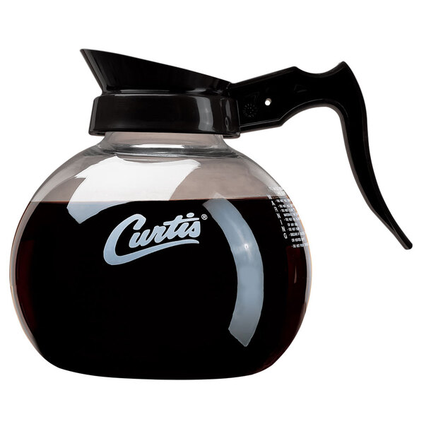 A Curtis glass coffee decanter with a black handle and white imprint.