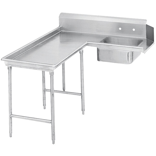 A stainless steel Advance Tabco soil dishtable on a stainless steel counter.