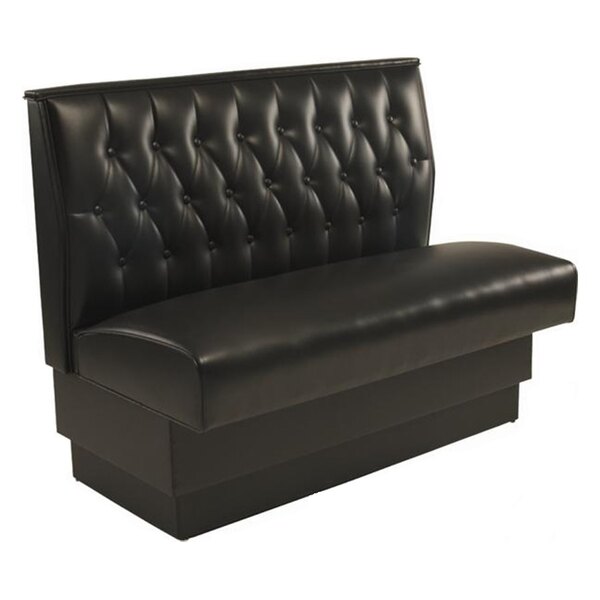 An American Tables & Seating black leather booth with a button tufted back.