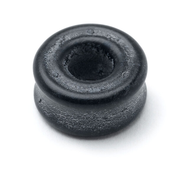 A round black rubber packing stem for a faucet with a hole in the center.