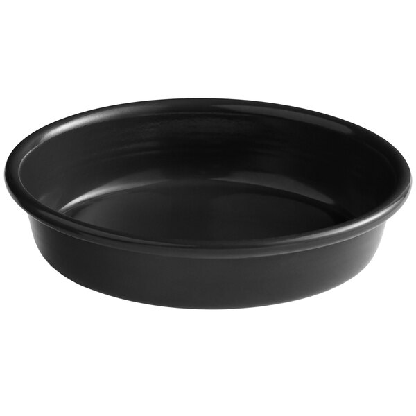 A black round deep dish pizza pan with a white background.