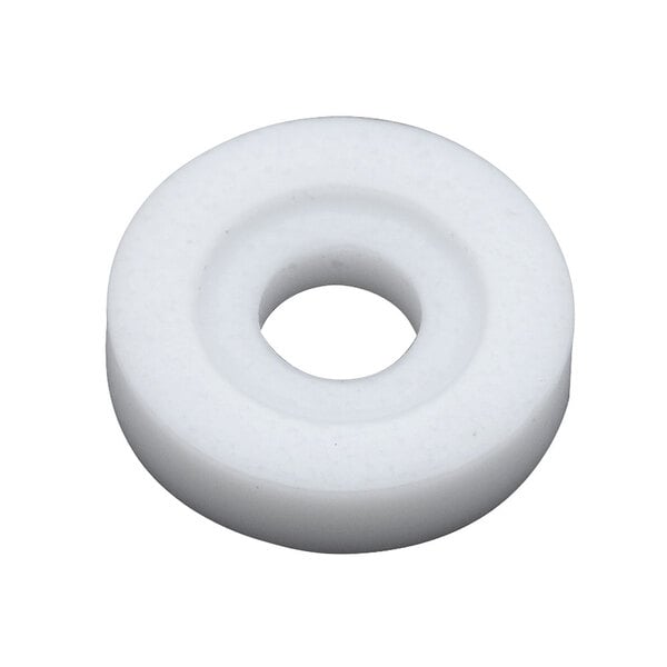 A white Teflon circle with a hole in it.