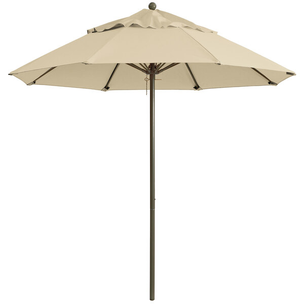 A khaki Grosfillex Windmaster umbrella on an aluminum pole.