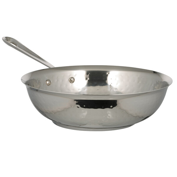 A Bon Chef Cucina stainless steel stir fry pan with a handle.