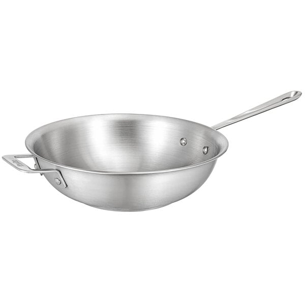 A Bon Chef stainless steel stir fry pan with a handle.