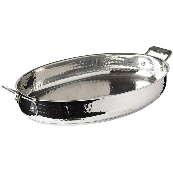 A silver Bon Chef stainless steel oval pan with a hammered finish and a handle.