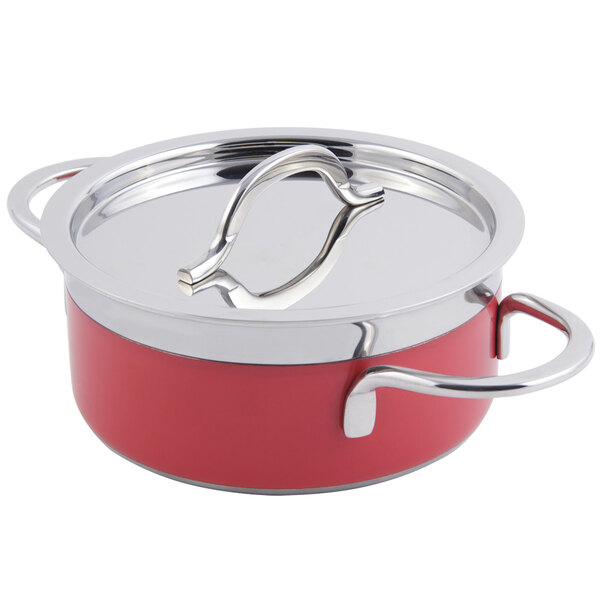 A red pot with a stainless steel handle and lid.