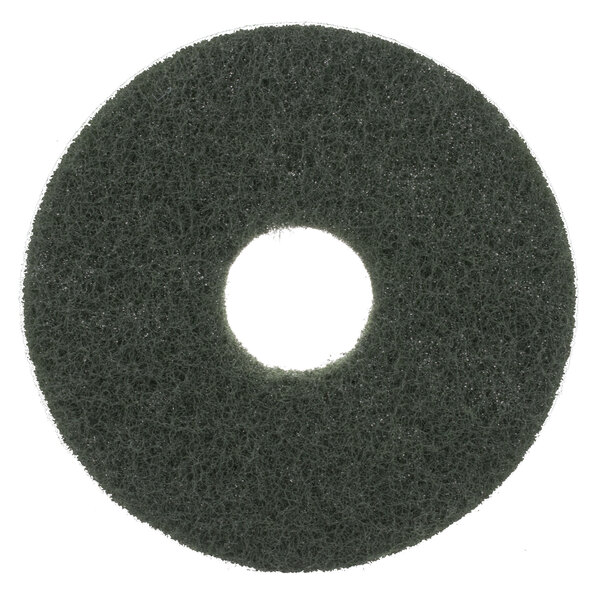 A green circular Scrubble floor pad with a white circle in the middle.