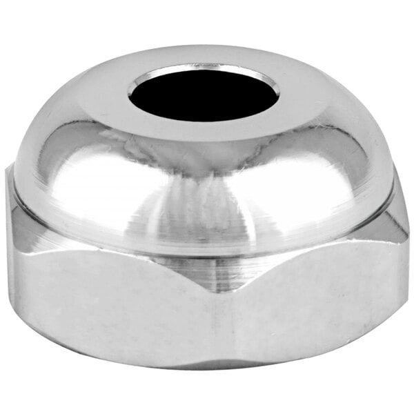 A silver plated round nut with a hole in it.