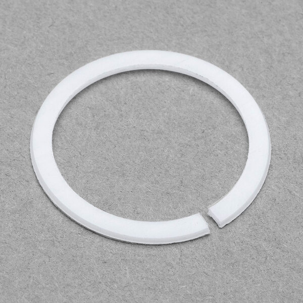 A white plastic circle with a split in it.