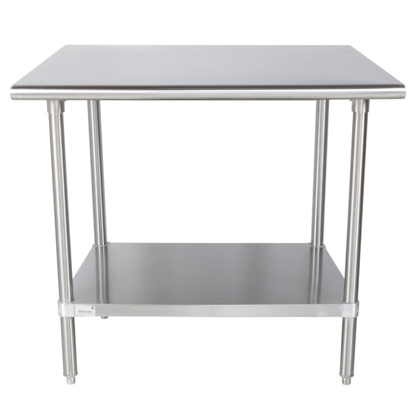 A stainless steel work table with a shelf.