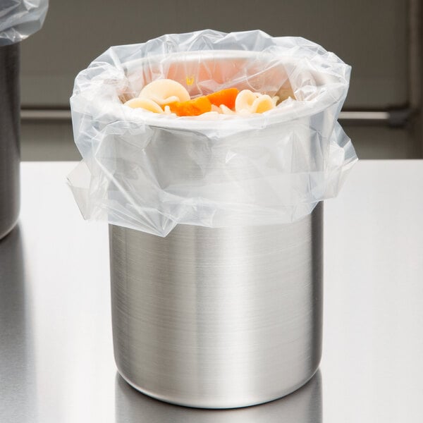 A silver stainless steel container with food in it.