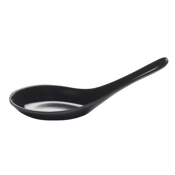 A black soup spoon with a long handle.