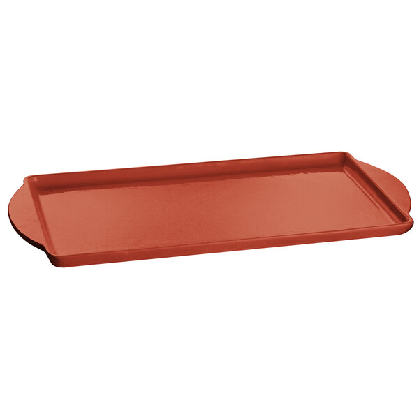A copper rectangular tray with a red handle.