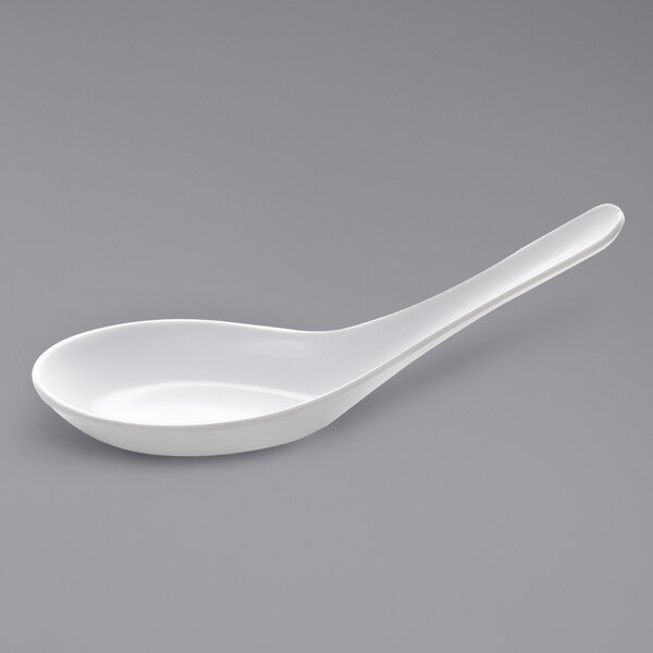 A white spoon with a handle.