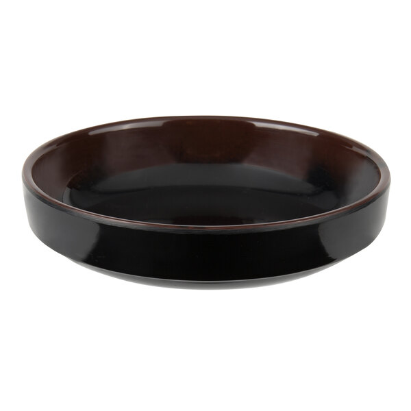 A close-up of a black Thunder Group melamine sauce bowl with brown and black accents.
