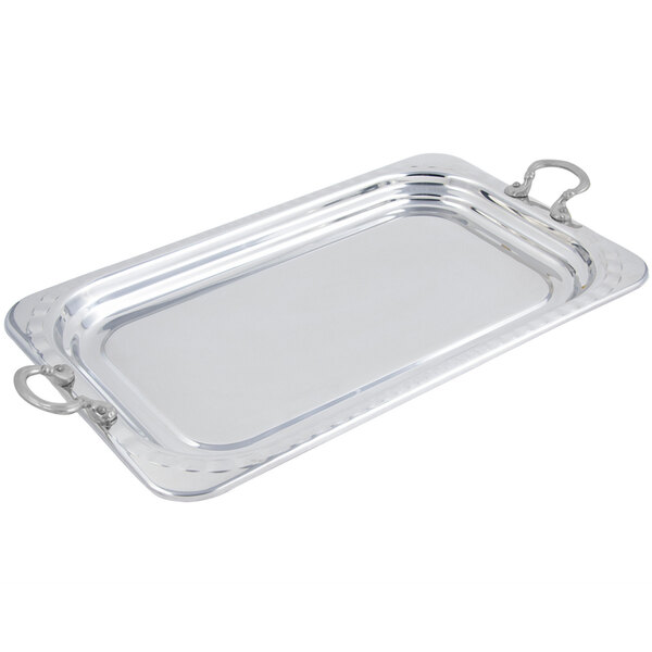 A stainless steel rectangular food pan with round handles.