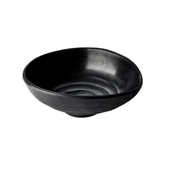 An Elite Global Solutions black melamine oval bowl with a small hole in the middle.