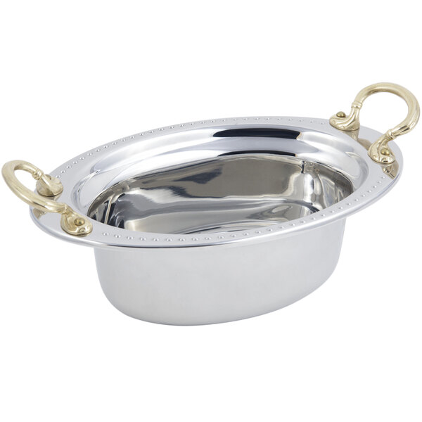 A silver Bon Chef oval food pan with round brass handles.