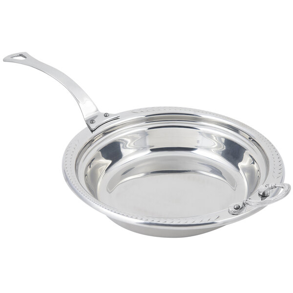A Bon Chef stainless steel food pan with a laurel design and long handle.