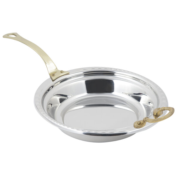 A stainless steel Bon Chef casserole food pan with a long brass handle and arches design.