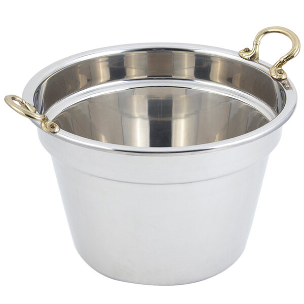 A stainless steel Bon Chef soup inset with round brass handles.
