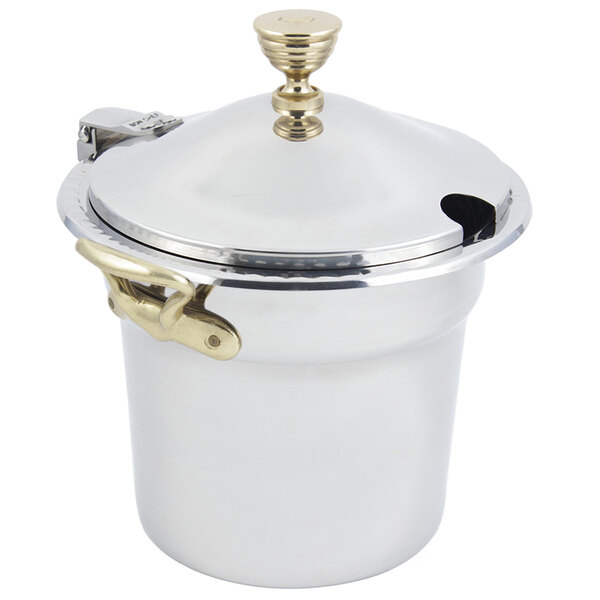 A white and silver stainless steel Bon Chef soup tureen with round brass handles and a hinged lid.