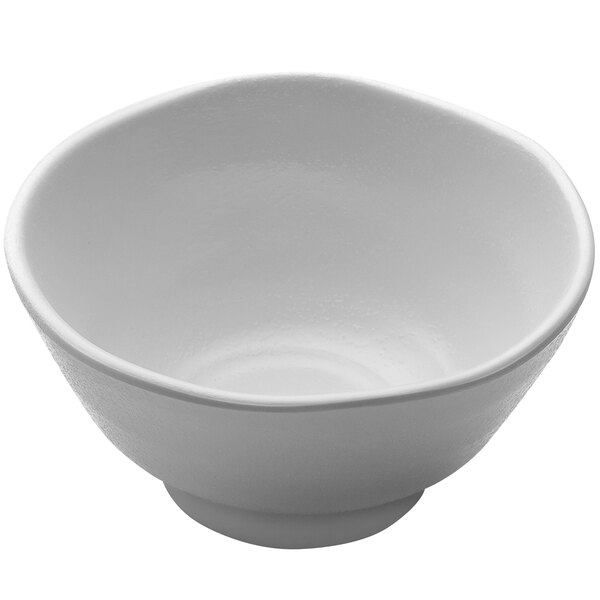 A close-up of an Elite Global Solutions white melamine bowl with a small rim.