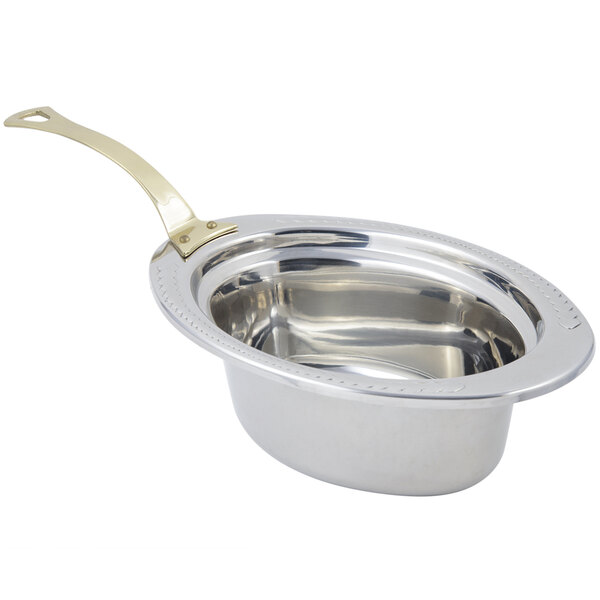 A Bon Chef stainless steel full size oval food pan with brass long handle.