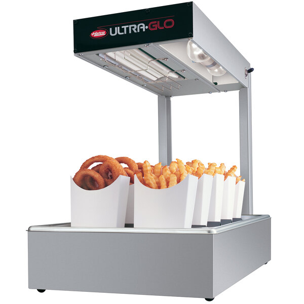 A Hatco Ultra-Glo food warmer with a tray of onion rings and fries.